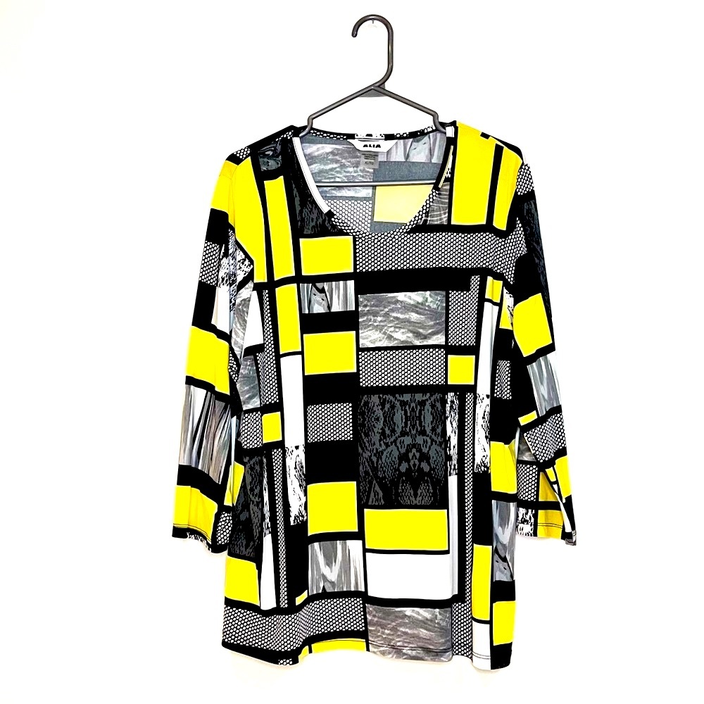 Alia vintage long-sleeve blouse with black and yellow dot pattern. Xl